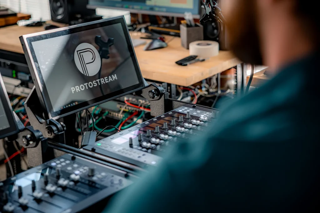 Professional audio engineers managing corporate event audio production for a large conference, ensuring clear sound in a live event environment